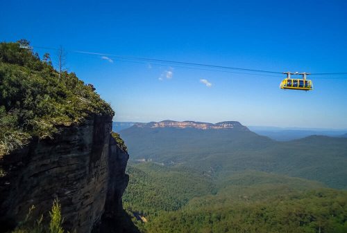 Glass-floored Scenic Skyway cable car gliding above the forest canopy with sweeping views of the Blue Mountains.